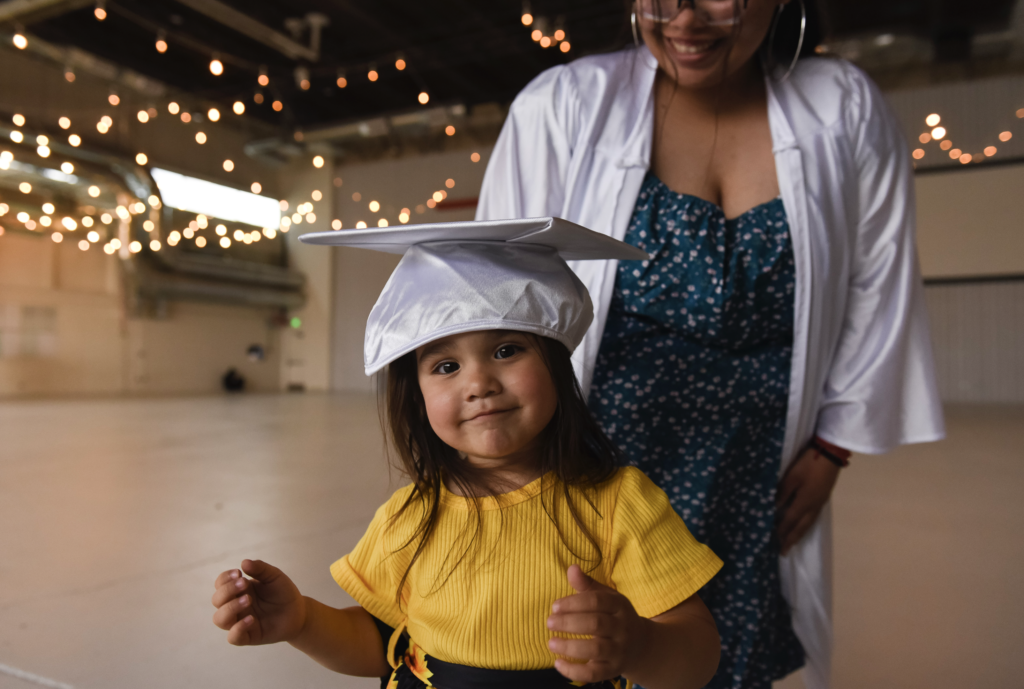 giving back a senior session - a senior poses with her young daughter 